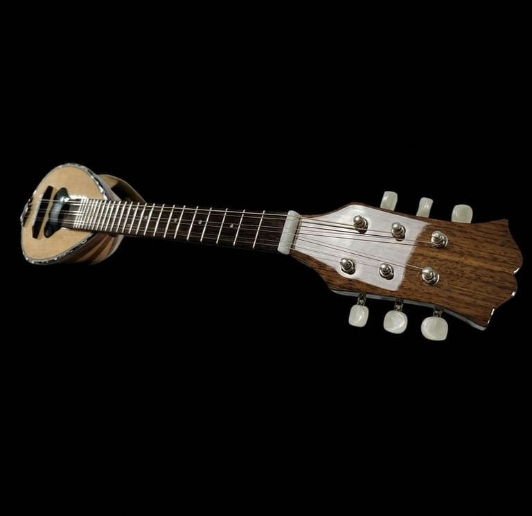 Weissenborn-style lap steel guitar with light wood body and multiple steel strings against black background