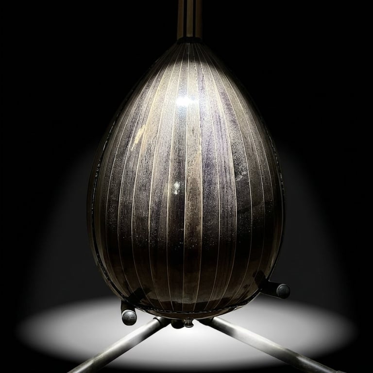 Modern egg-shaped pendant lamp with vertical ridged glass shade, glowing from within, mounted on tripod base