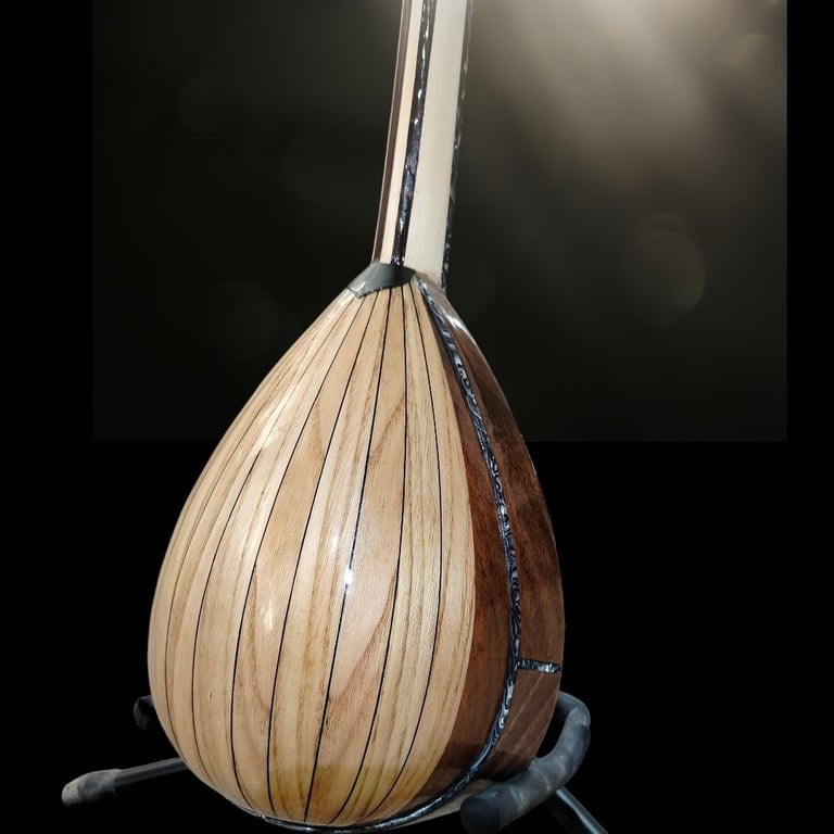Close-up of a wooden drum or percussion instrument with vertical ribbed texture and metal stand against dark background