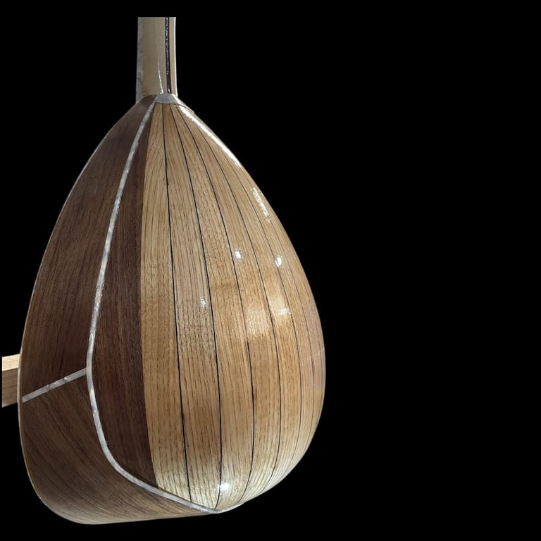 Decorative pendant light with a woven wooden teardrop shade against black background